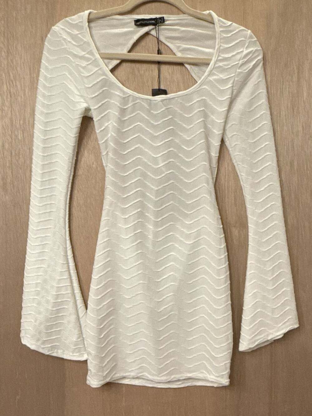 PrettyLittleThing Cream Textured Open Back Flare Sleeve Mini Dress